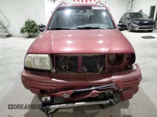 1999 Suzuki Vitara JX z VIN 2S3TD52V4X6110057, wystawiony jako Copart lot #87752215 z przebiegiem 245 419 mil mil oraz Szkody całkowita. Historia ofert i sprzedaży dostępna na DreamBid. Obrazek 5.
