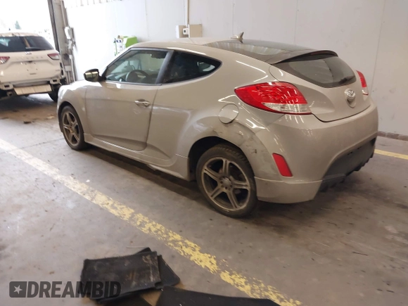 2013 Hyundai Veloster w/Black Int with VIN KMHTC6AD2DU128534, listed as a IAAI auction lot 41791398 with 158,414 mi miles and . Bid and sale history available at DreamBid. Image 3.