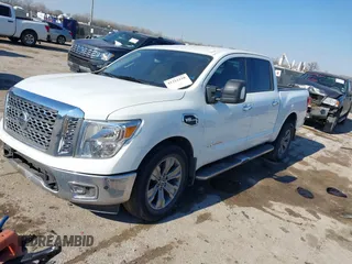 2017 Nissan Titan SL with VIN 1N6AA1E64HN565318, listed as a IAAI auction lot 41322120 with 114,515 mi miles and . Bid and sale history available at DreamBid. Image 2.