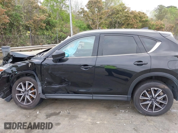 2018 Mazda CX-5 Grand Touring with VIN JM3KFBDM1J0358197, listed as a IAAI auction lot 41967940 with 148,119 mi miles and . Bid and sale history available at DreamBid. Image 14.