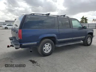 1997 Chevrolet Suburban z VIN 1GNFK16R9VJ309720, wystawiony jako Copart lot #48814475 z przebiegiem 198 109 mil mil oraz Czysty tytuł • Clean title. Historia ofert i sprzedaży dostępna na DreamBid. Obrazek 3.