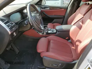 2024 BMW X4 xDrive30i z VIN 5UX33DT09R9U71062, wystawiony jako Copart lot #52200375 z przebiegiem 21 979 mil mil oraz Szkoda całkowita • Salvage title. Historia ofert i sprzedaży dostępna na DreamBid. Obrazek 7.