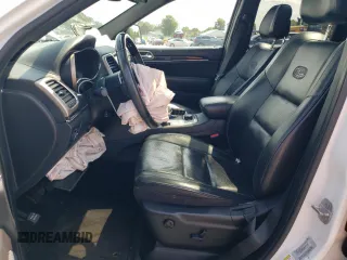 2015 Jeep Grand Cherokee Overland with VIN 1C4RJFCG6FC797653, listed as a Copart auction lot 65186695 with Not provided miles and Salvage title. Bid and sale history available at DreamBid. Image 7.
