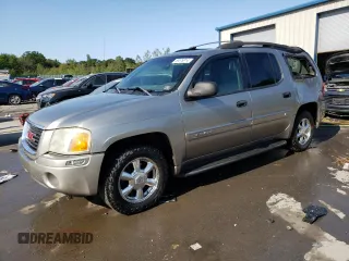2003 GMC Envoy SLT z VIN 1GKET16S936141313, wystawiony jako Copart lot #69576914 z przebiegiem 236 037 mil mil oraz Szkody całkowita. Historia ofert i sprzedaży dostępna na DreamBid. Obrazek 1.
