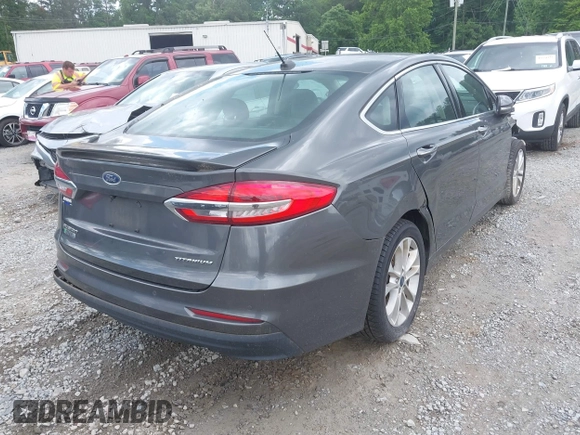 2019 Ford Fusion Titanium with VIN 3FA6P0SU9KR126985, listed as a IAAI auction lot 42255509 with 138,779 mi miles and . Bid and sale history available at DreamBid. Image 4.