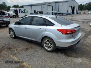 2017 Ford Focus SE with VIN 1FADP3F29HL242325, listed as a Copart auction lot 61153555 with 136,666 mi miles and Salvage title. Bid and sale history available at DreamBid. Image 2.