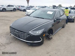 2021 Hyundai Sonata Hybrid SEL with VIN KMHL34JJ1MA024239, listed as a IAAI auction lot 41707290 with 165,214 mi miles. Bid and sale history available at carsss.com. Image 2.