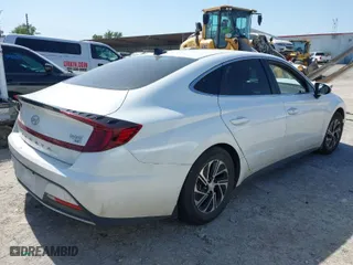 2023 Hyundai Sonata Hybrid Blue with VIN KMHL24JJ4PA062720, listed as a IAAI auction lot 40462677 with 60,007 mi miles. Bid and sale history available at carsss.com. Image 4.