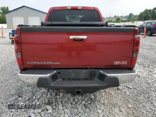2010 GMC Canyon SLE1 with VIN 1GTJTCDE4A8143006, listed as a Copart auction lot 60853175 with 148,457 mi miles and Salvage title. Bid and sale history available at DreamBid. Image 6.