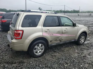 2010 Ford Escape Limited with VIN 1FMCU0EGXAKA03092, listed as a Copart auction lot 61094785 with 114,884 mi miles and Salvage title. Bid and sale history available at DreamBid. Image 3.