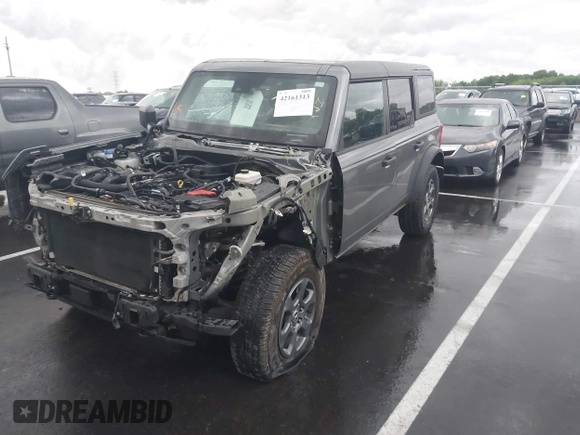 2022 Ford Bronco with VIN 1FMDE5BH5NLB12538, listed as a IAAI auction lot 42161313 with 64,518 mi miles and . Bid and sale history available at DreamBid. Image 2.