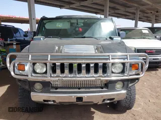 2005 Hummer H2 SUV with VIN 5GRGN23U25H107505, listed as a IAAI auction lot 41703768 with 213,723 mi miles. Bid and sale history available at carsss.com. Image 12.