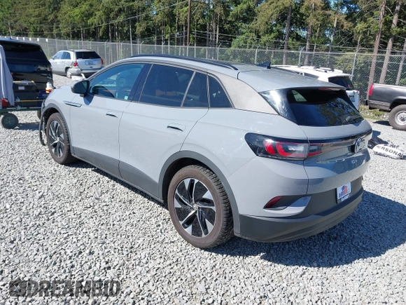 2021 Volkswagen ID.4 Pro S z VIN WVGTMPE20MP058882, wystawiony jako IAAI lot #42317440 z przebiegiem 64 473 mil mil oraz . Historia ofert i sprzedaży dostępna na DreamBid. Obrazek 3.