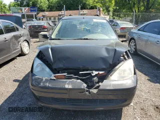 2004 Ford Focus ZTW with VIN 1FAFP35Z84W203676, listed as a Copart auction lot 57272835 with 183,115 mi miles and Salvage title. Bid and sale history available at DreamBid. Image 5.