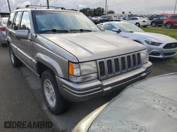 1998 Jeep Grand Cherokee Limited with VIN 1J4GZ78S2WC222768, listed as a Copart auction lot 73942154 with Not provided miles and Salvage title. Bid and sale history available at DreamBid. Image 5.