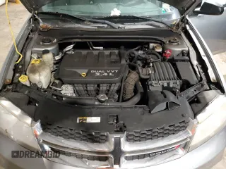 2014 Dodge Avenger SE z VIN 1C3CDZAB3EN160734, wystawiony jako Copart lot #58937135 z przebiegiem 115 311 mil mil oraz Tytuł czysty. Historia ofert i sprzedaży dostępna na DreamBid. Obrazek 11.