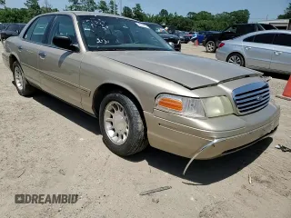 1999 Ford Crown Victoria LX z VIN 2FAFP74W1XX122364, wystawiony jako Copart lot #56929455 z przebiegiem 118 134 mil mil oraz Szkody całkowita. Historia ofert i sprzedaży dostępna na DreamBid. Obrazek 13.