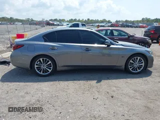2018 Infiniti Q50 Luxe with VIN JN1EV7AP4JM590048, listed as a IAAI auction lot 41863410 with 55,727 mi miles and . Bid and sale history available at carsss.com. Image 13.