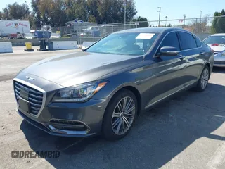 2018 Genesis G80 3.8L z VIN KMHGN4JEXJU283935, wystawiony jako IAAI lot #41750441 z przebiegiem 70 165 mil mil oraz . Historia ofert i sprzedaży dostępna na DreamBid. Obrazek 2.