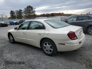 2001 Oldsmobile Aurora z VIN 1G3GS64CX14180971, wystawiony jako Copart lot #79035554 z przebiegiem 62 228 mil mil oraz Szkody całkowita. Historia ofert i sprzedaży dostępna na DreamBid. Obrazek 2.
