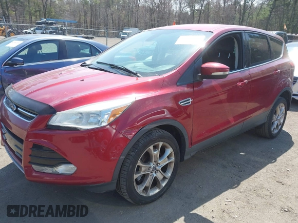 2013 Ford Escape SEL with VIN 1FMCU9H92DUD25669, listed as a IAAI auction lot 42070876 with 133,613 mi miles. Bid and sale history available at carsss.com. Image 2.