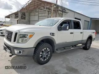 2016 Nissan Titan Pro-4X with VIN 1N6BA1F42GN507692, listed as a Copart auction lot 59194685 with 113,578 mi miles and Clean title. Bid and sale history available at DreamBid. Image 1.