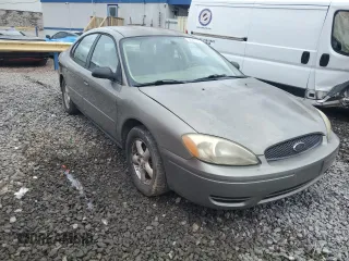 2004 Ford Taurus SE with VIN 1FAFP53274A193186, listed as a Copart auction lot 60255125 with 184,493 mi miles and Salvage title. Bid and sale history available at DreamBid. Image 4.