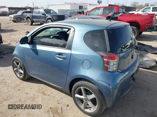 2012 Scion iQ with VIN JTNJJXB09CJ019082, listed as a IAAI auction lot 41798707 with 120,628 mi miles. Bid and sale history available at carsss.com. Image 3.