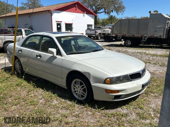 2000 Mitsubishi Diamante LS z VIN 6MMAP67P4YT001142, wystawiony jako Copart lot #49667135 z przebiegiem 243 861 mil mil oraz Tytuł czysty. Historia ofert i sprzedaży dostępna na DreamBid. Obrazek 1.