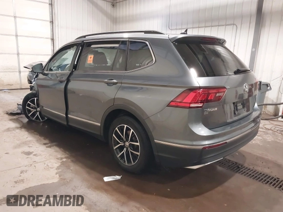 2021 Volkswagen Tiguan SE with VIN 3VV3B7AX3MM118463, listed as a IAAI auction lot 42138702 with 48,058 mi miles and . Bid and sale history available at DreamBid. Image 3.