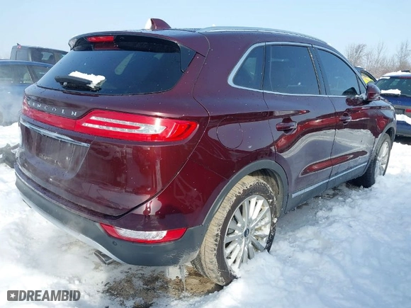 2019 Lincoln MKC Standard with VIN 5LMCJ1D95KUL09718, listed as a IAAI auction lot 41672747 with 73,810 mi miles. Bid and sale history available at carsss.com. Image 4.
