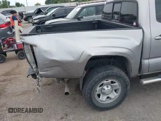 2017 Toyota Tacoma SR with VIN 5TFAX5GN6HX083614, listed as a IAAI auction lot 42314254 with 104,407 mi miles and . Bid and sale history available at DreamBid. Image 6.