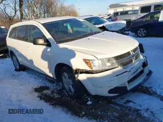 2015 Dodge Journey SE z VIN 3C4PDCAB7FT541062, wystawiony jako IAAI lot #41287953 z przebiegiem 173 246 mil mil oraz . Historia ofert i sprzedaży dostępna na DreamBid. Obrazek 1.