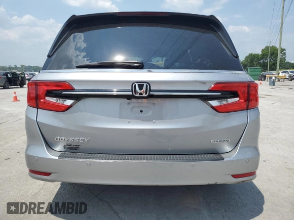 2023 Honda Odyssey Touring z VIN 5FNRL6H8XPB037385, wystawiony jako Copart lot #59461215 z przebiegiem 32 150 mil mil oraz Szkoda całkowita • Salvage title. Historia ofert i sprzedaży dostępna na DreamBid. Obrazek 6.