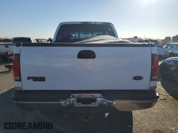 2000 Ford Super Duty F-250 XL with VIN 1FTNW21S1YED65639, listed as a Copart auction lot 74377194 with 158,387 mi miles and Salvage Title. Bid and sale history available at carsss.com. Image 6.