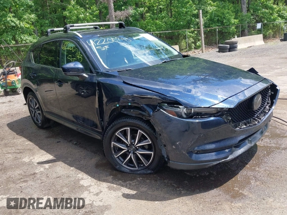 2018 Mazda CX-5 Grand Touring with VIN JM3KFBDM2J0373386, listed as a IAAI auction lot 42200795 with 70,111 mi miles and . Bid and sale history available at DreamBid. Image 1.
