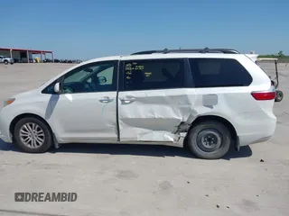 2015 Toyota Sienna XLE with VIN 5TDYK3DCXFS663083, listed as a IAAI auction lot 41967621 with 177,472 mi miles and . Bid and sale history available at DreamBid. Image 14.