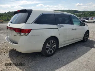 2014 Honda Odyssey Touring with VIN 5FNRL5H94EB080815, listed as a Copart auction lot 65244325 with 153,314 mi miles and Salvage title. Bid and sale history available at DreamBid. Image 3.