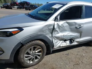 2018 Hyundai Tucson SEL with VIN KM8J3CA42JU771483, listed as a IAAI auction lot 42159936 with 91,604 mi miles and . Bid and sale history available at DreamBid. Image 6.