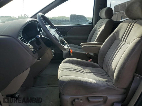 2001 Toyota Sienna LE with VIN 4T3ZF13C51U345619, listed as a Copart auction lot 71761094 with 165,000 mi miles and Salvage Title. Bid and sale history available at carsss.com. Image 7.