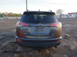 2016 Toyota RAV4 LE with VIN JTMBFREV1GD187414, listed as a IAAI auction lot 42033130 with 123,955 mi miles and . Bid and sale history available at carsss.com. Image 16.