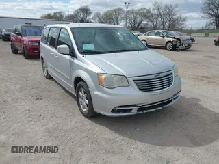 2011 Chrysler Town & Country Touring with VIN 2A4RR5DGXBR780044, listed as a IAAI auction lot 42035045 with 205,627 mi miles and . Bid and sale history available at DreamBid. Image 1.