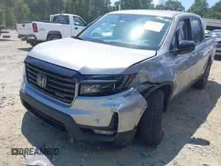 2021 Honda Ridgeline Sport with VIN 5FPYK3F10MB021413, listed as a IAAI auction lot 39847416 with 28,044 mi miles and . Bid and sale history available at DreamBid. Image 6.