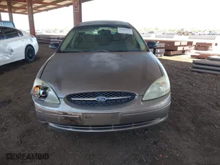 2002 Ford Taurus LX with VIN 1FAFP52U72G284116, listed as a IAAI auction lot 42004075 with 86,544 mi miles. Bid and sale history available at carsss.com. Image 12.