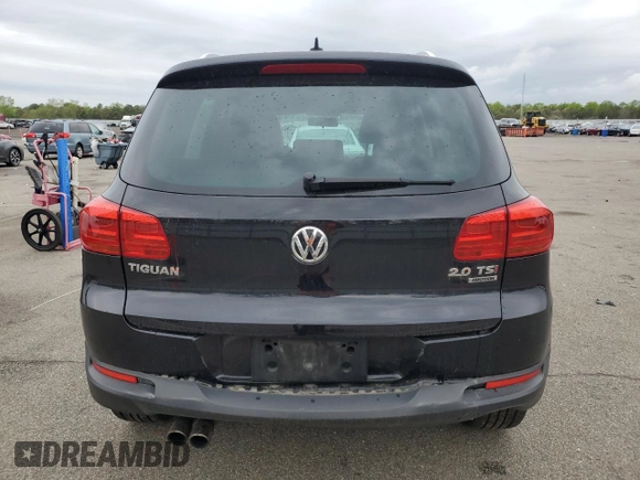 2014 Volkswagen Tiguan S z VIN WVGBV3AX5EW554500, wystawiony jako Copart lot #57016775 z przebiegiem 91 101 mil mil oraz Szkoda całkowita • Salvage title. Historia ofert i sprzedaży dostępna na DreamBid. Obrazek 6.