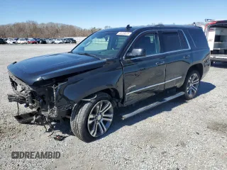 2015 GMC Yukon Denali with VIN 1GKS2CKJ5FR612147, listed as a Copart auction lot 49209525 with 127,262 mi miles and Salvage Title. Bid and sale history available at carsss.com. Image 1.