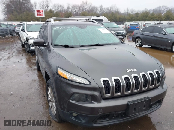 2014 Jeep Cherokee Latitude z VIN 1C4PJMCS5EW137875, wystawiony jako IAAI lot #41475923 z przebiegiem 124 565 mil mil oraz . Historia ofert i sprzedaży dostępna na DreamBid. Obrazek 1.