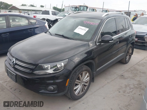 2012 Volkswagen Tiguan SE with VIN WVGAV7AX9CW611202, listed as a IAAI auction lot 41944210 with 118,002 mi miles and . Bid and sale history available at DreamBid. Image 2.