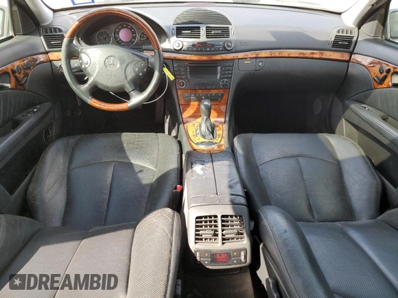 2003 Mercedes-Benz E-Class 5.0L with VIN WDBUF70J73A119596, listed as a Copart auction lot 77382424 with 237,620 mi miles and Salvage Title. Bid and sale history available at carsss.com. Image 8.