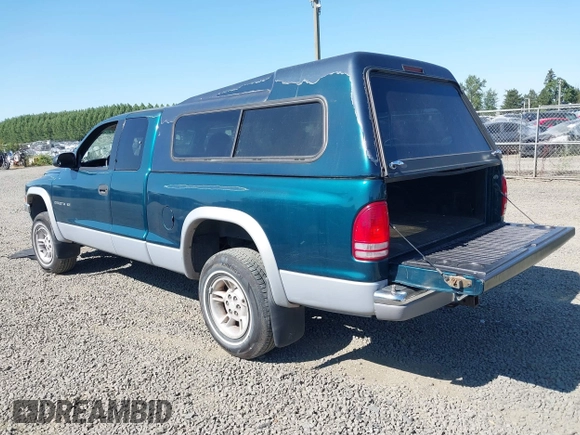 1999 Dodge Dakota SLT with VIN 1B7GG22Y2XS157214, listed as a IAAI auction lot 39776504 with 144,928 mi miles and . Bid and sale history available at carsss.com. Image 3.